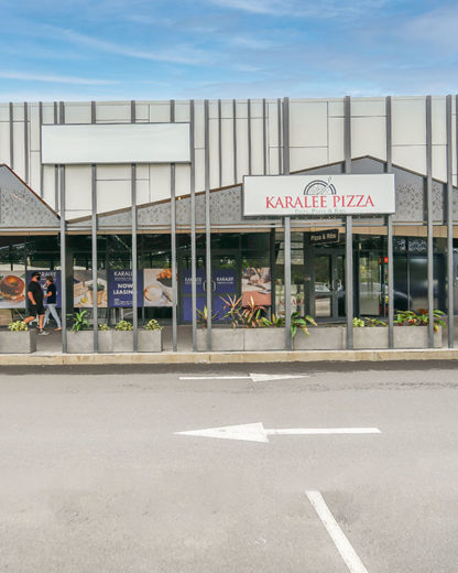 GRC Pitted Trough Planters align in front of Karalee Pizza