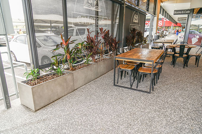 concrete trough planters in restaurant