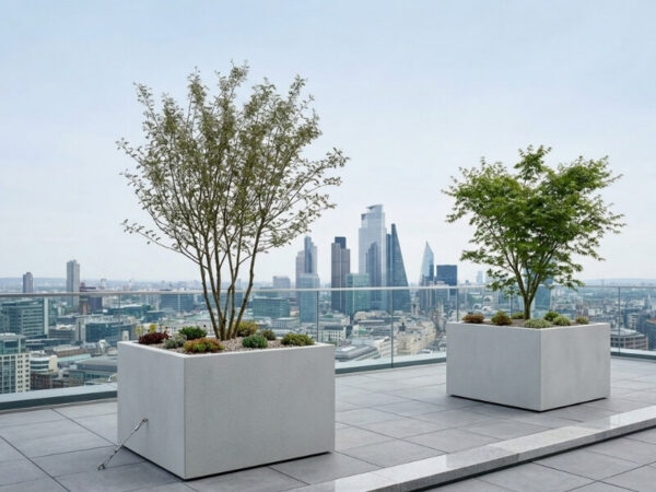 Large fibreglass planters secured on a high-rise rooftop garden.