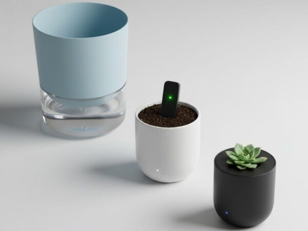 Flat lay of three different smart planters in various sizes and styles for comparison.