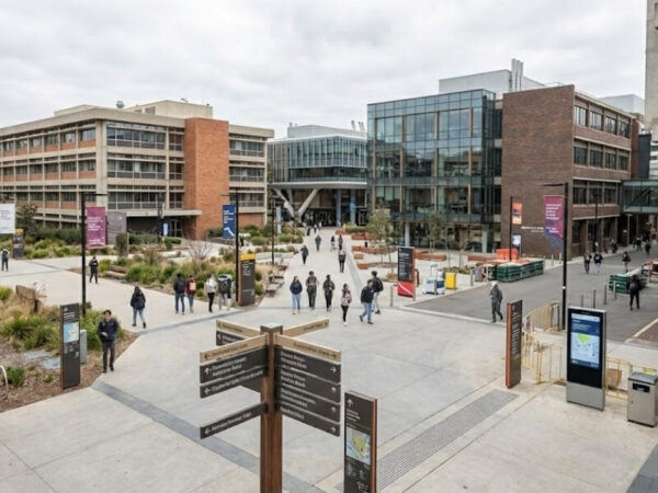 Large campus entrance with multiple signs and complex pathways.