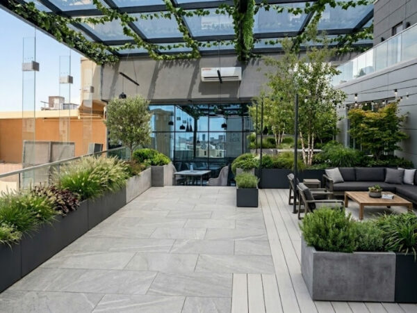 Rectangular planter boxes creating a landscaped rooftop oasis on a modern commercial building