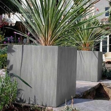 Extra large pots for outdoor plants in Milano Cube 800 planted with ornamental greenery
