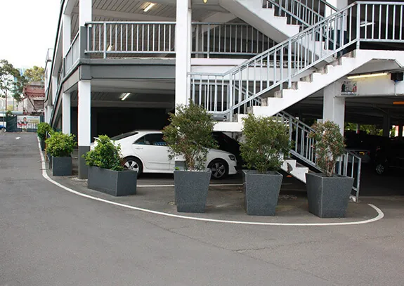 A combination of IOTA Granite Trough and Taper planters