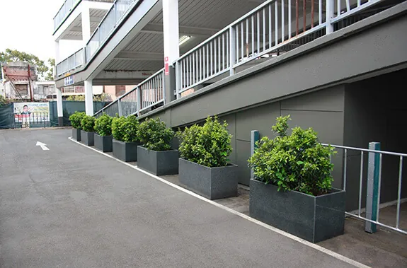 A closer view of IOTA granite trough planters