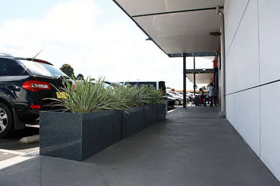 Low planting using IOTA Granite Planters at Stanhope Village Shopping Centre