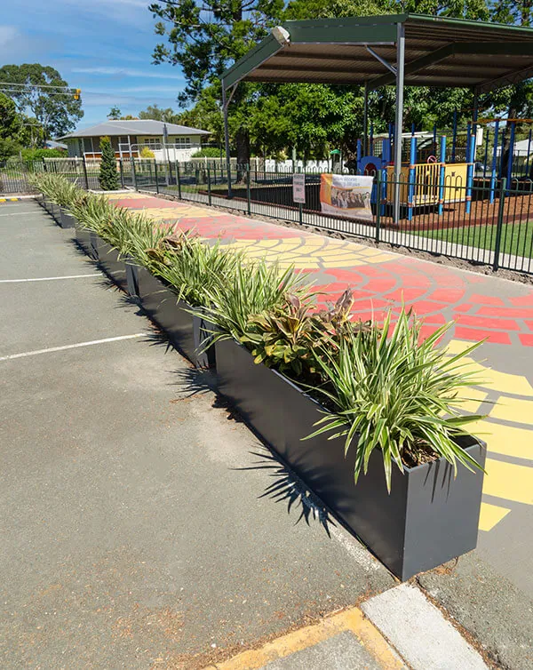 Line of Large Manhattan Rectangular Planter Box in a public space