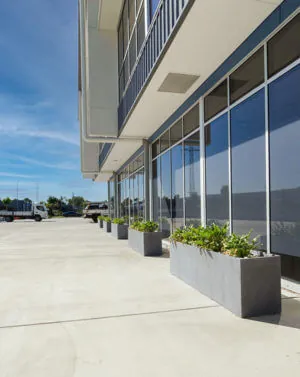 Outdoor Milano Trough Planter Boxes lined up on Multi Span Australia