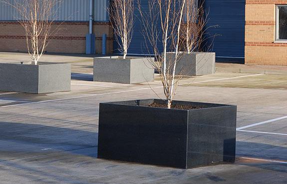 The custom planters are 1300mm square, constructed in 25mm thick granite 