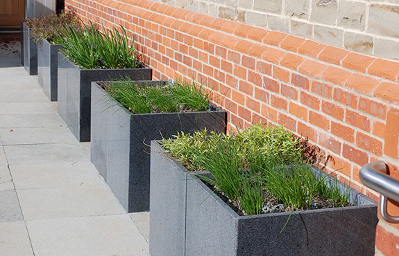 Granite Cube 600 planters at the entrance to The Barn meeting room