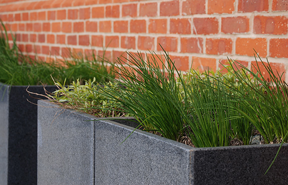 A pair of Tall Taper XXL planters at the entrance to the Spa.