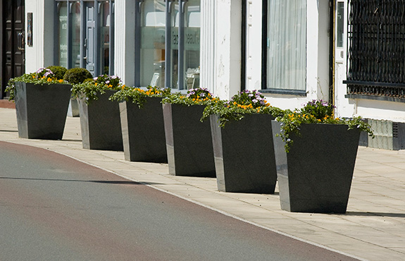 Granite taper planters in a line